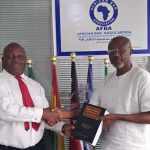 Mr Emeka Arinze presents book to the AFBA President